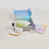 Altyr Toolkit: Manifest Now box with simple aura colored design including Clear Quartz Crystal, Tuning Fork 512 Hz, Palo Santo and Smudging Feather, I WILL Herbal Tea, Clarity Organic Essential Oil Roller, and Release papers