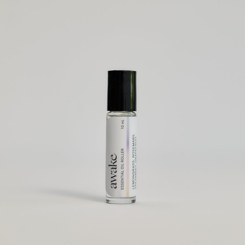 Awake Essential Oil Roller package on a white floor