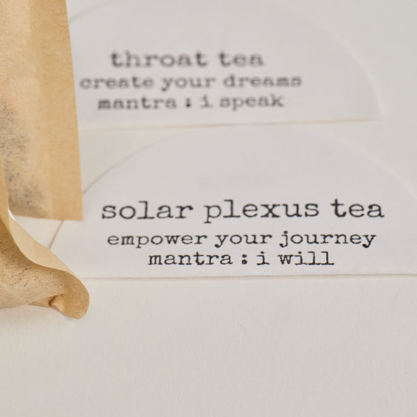 Name tags of two of the bags from the Chakra Tea Collection package, which are Solar Plexus Tea and Throat Tea