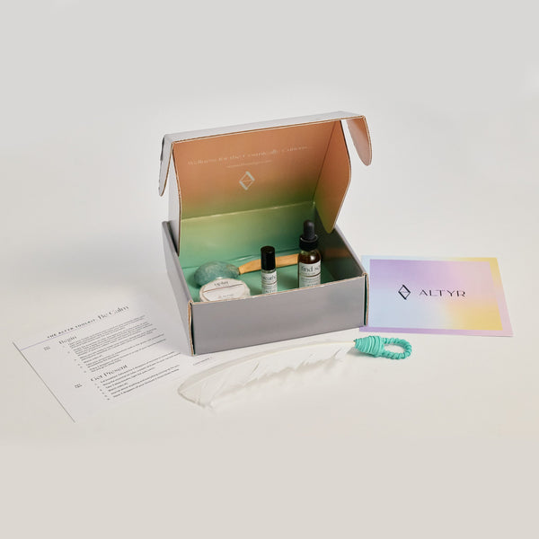 Altyr Toolkit: Be Calm box with simple aura colored design including Amazonite Stone, Palo Santo and Smudging Feather, Find Serenity Calm Elixir Herbal Tincture, Breathe Essential Oil Roller and Uplift Rose Bath Bomb
