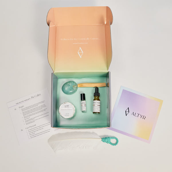 Altyr Toolkit: Be Calm box with simple aura colored design including Amazonite Stone, Palo Santo and Smudging Feather, Find Serenity Calm Elixir Herbal Tincture, Breathe Essential Oil Roller and Uplift Rose Bath Bomb