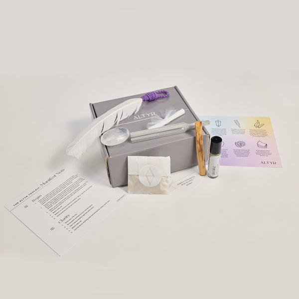 Altyr Toolkit: Manifest Now box with simple aura colored design including Clear Quartz Crystal, Tuning Fork 512 Hz, Palo Santo and Smudging Feather, I WILL Herbal Tea, Clarity Organic Essential Oil Roller, and Release papers