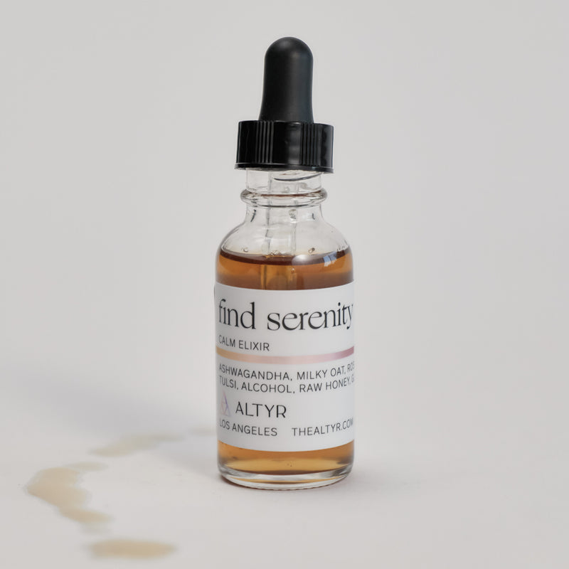 Find Serenity Calm Elixir bottle on a white floor