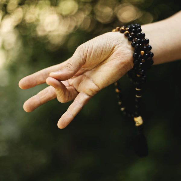 The hand of a person meditating 